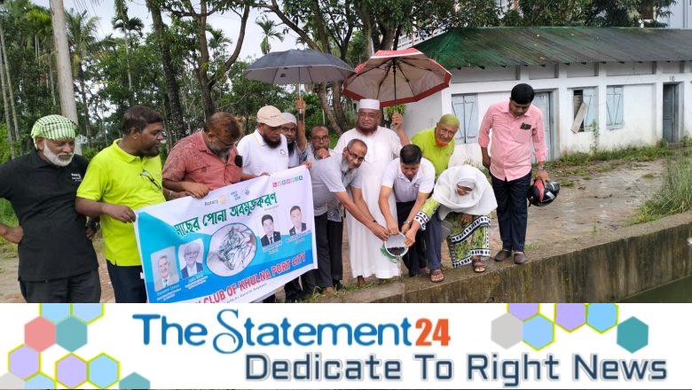 Khulna Rotary Club members plant saplings & release fingerlings in ponds